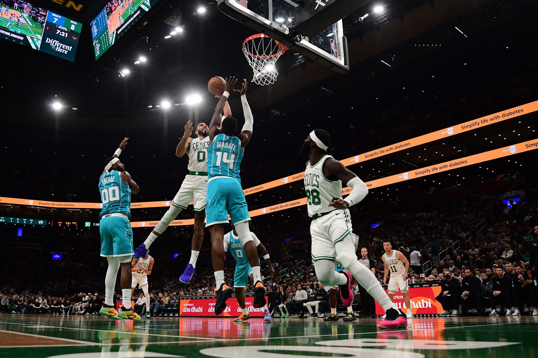 Oct 14, 2026; Boston, Massachusetts, USA;  Boston Celtics forward Jayson Tatum (0) shoots the ball while Charlotte Hornets forward Moussa Diabate (14) defends during the first half at TD Garden. Mandatory Credit: Bob DeChiara-Imagn Images