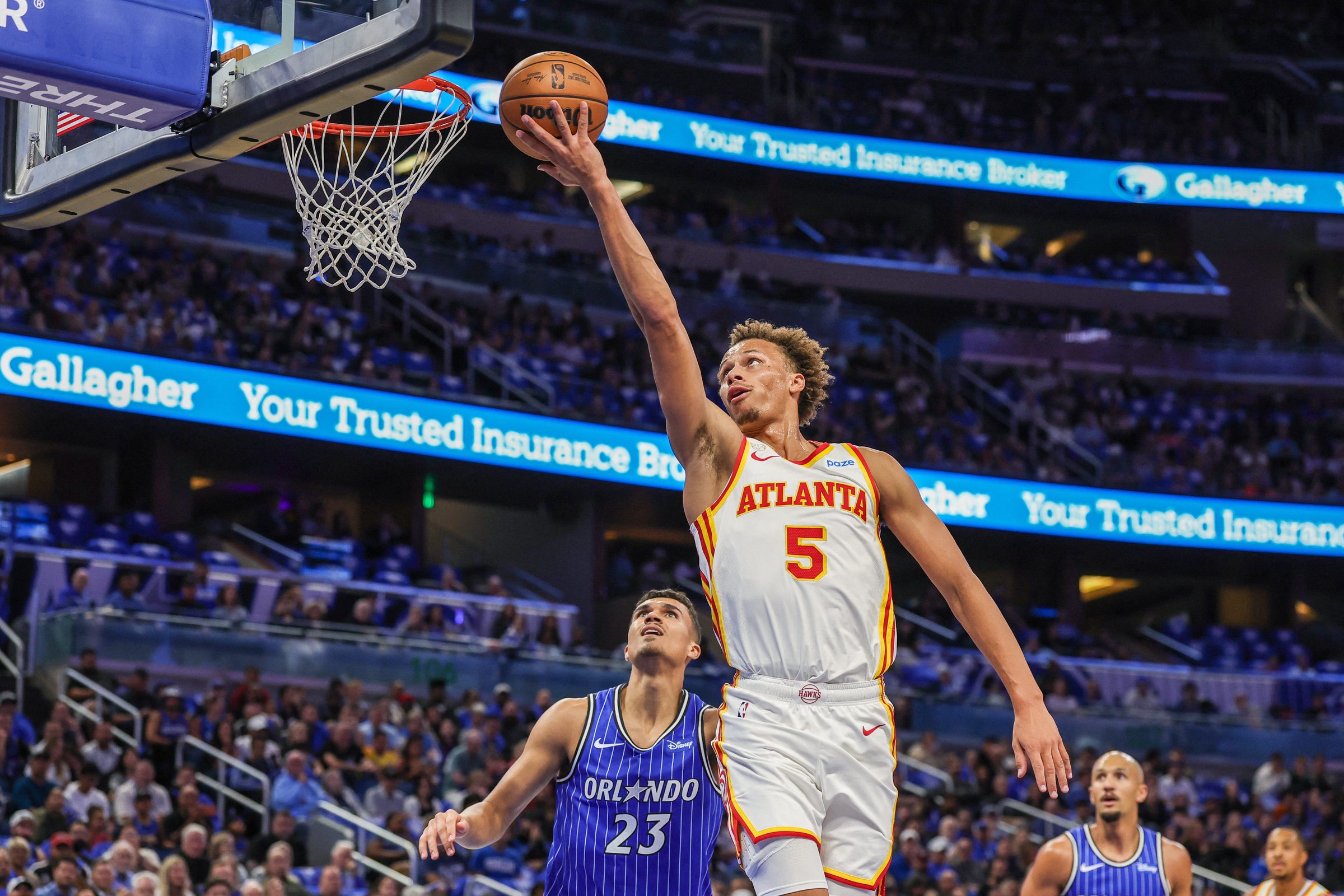 Oct 21, 2026; Orlando, Florida, USA;  Atlanta Hawks guard Dyson Daniels (5) shoots against Orlando Magic forward Tristan da Silva (23) during the first quarter at Kia Center.  Mandatory Credit: Mike Watters-Imagn Images