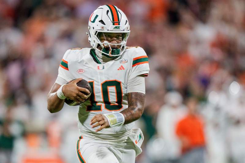 Miami quarterback Darian Mensah runs with the ball in the first half of an Oct. 3 game against Clemson.