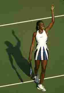 venus williams wears a white and blue dress at the 2002 us open