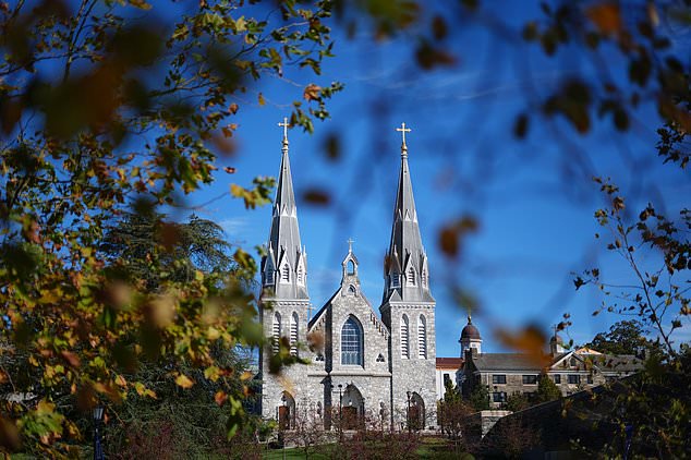 St. Thomas of Villanova Church is seen through autumn leaves at Villanova University in Villanova, Pa., Wednesday, Oct. 21, 2026. (AP Photo/Matt Rourke)