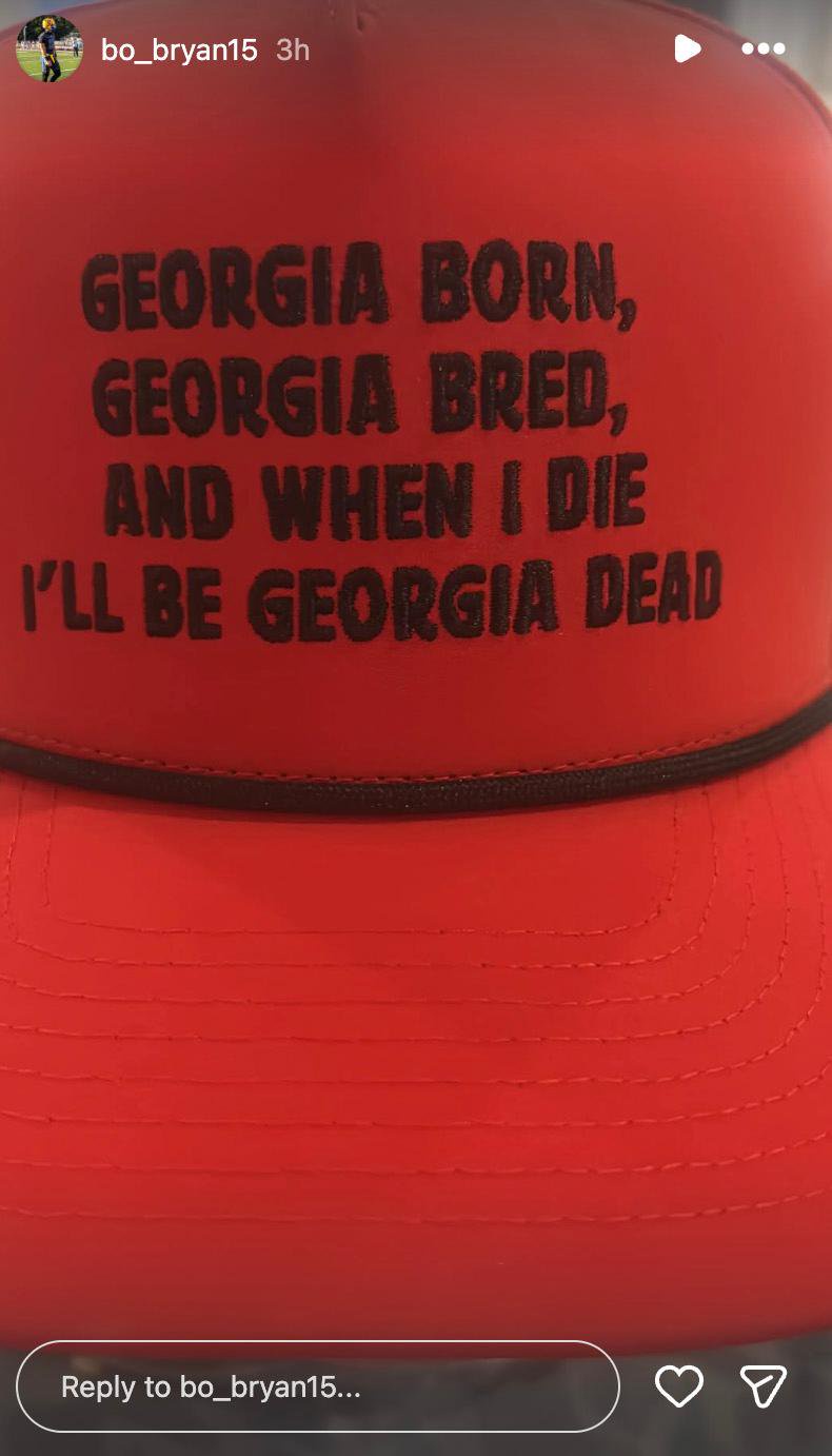 A red hat with the text "GEORGIA BORN, GEORGIA BRED, AND WHEN I DIE I'LL BE GEORGIA DEAD".