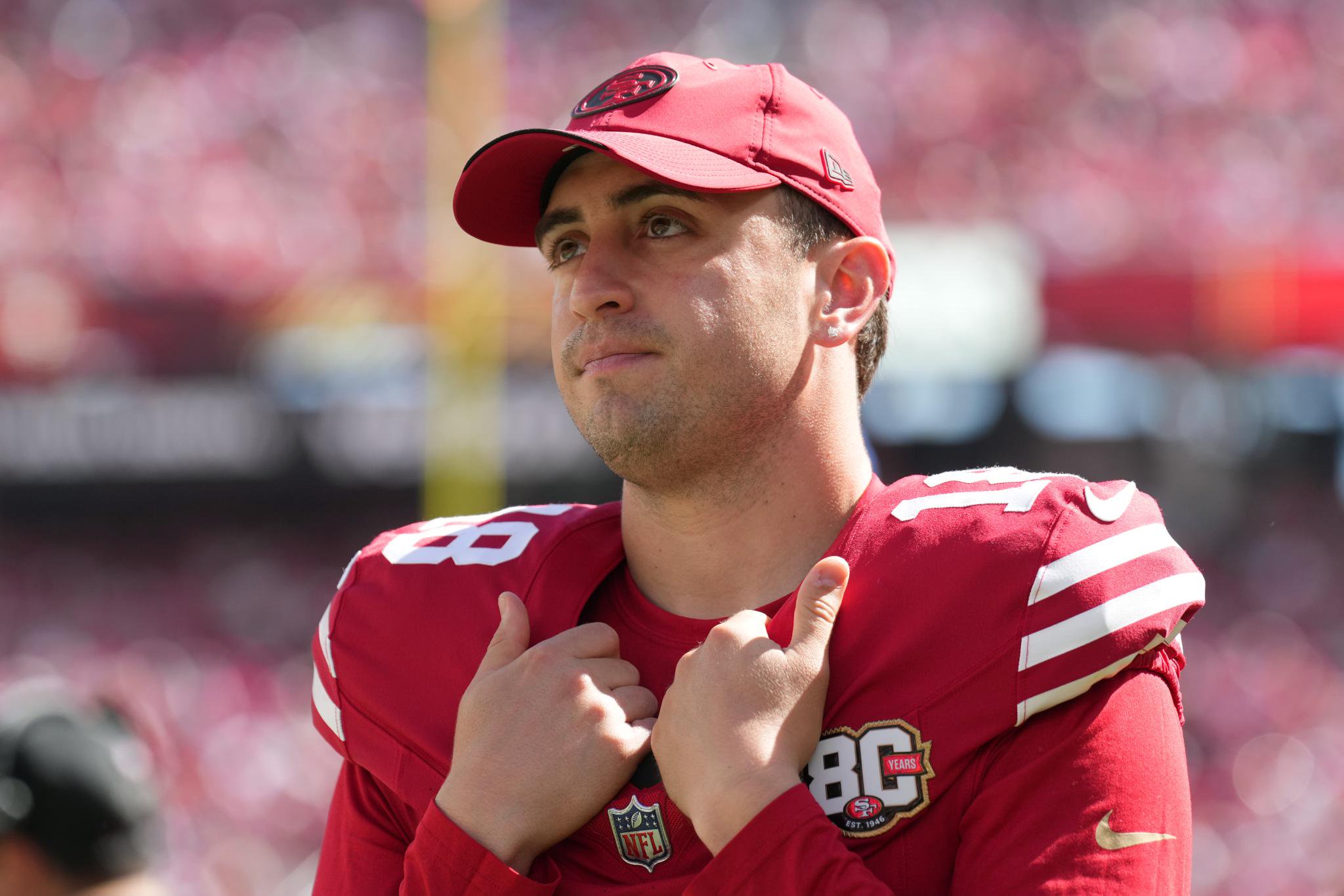San Francisco 49ers place kicker Eddy Pineiro adjusts his jersey.