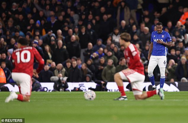Issa Diop (right) also stood while other players took the knee prior to Ipswich Town's clash with Nottingham Forest on Friday night