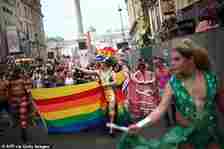 Parade participants in fancy dress march through London during the annual Pride event