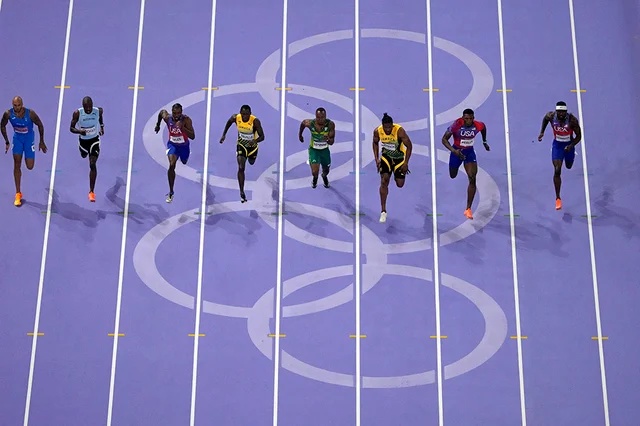 Athletes compete in the mens 100-meter final