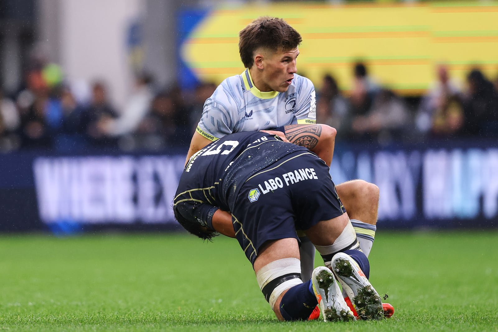 Sam Prendergast, Leinster's 'demi-d’ouverture', is tackled by Clermont Auvergne's Darcy Swain. Photograph: Ben Brady/Inpho