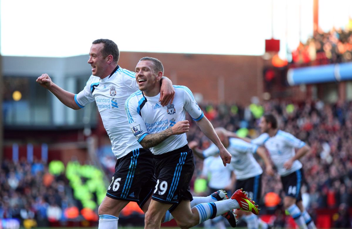 Charlie Adam of Liverpool and Craig Bellamy of Liverpool celebrate