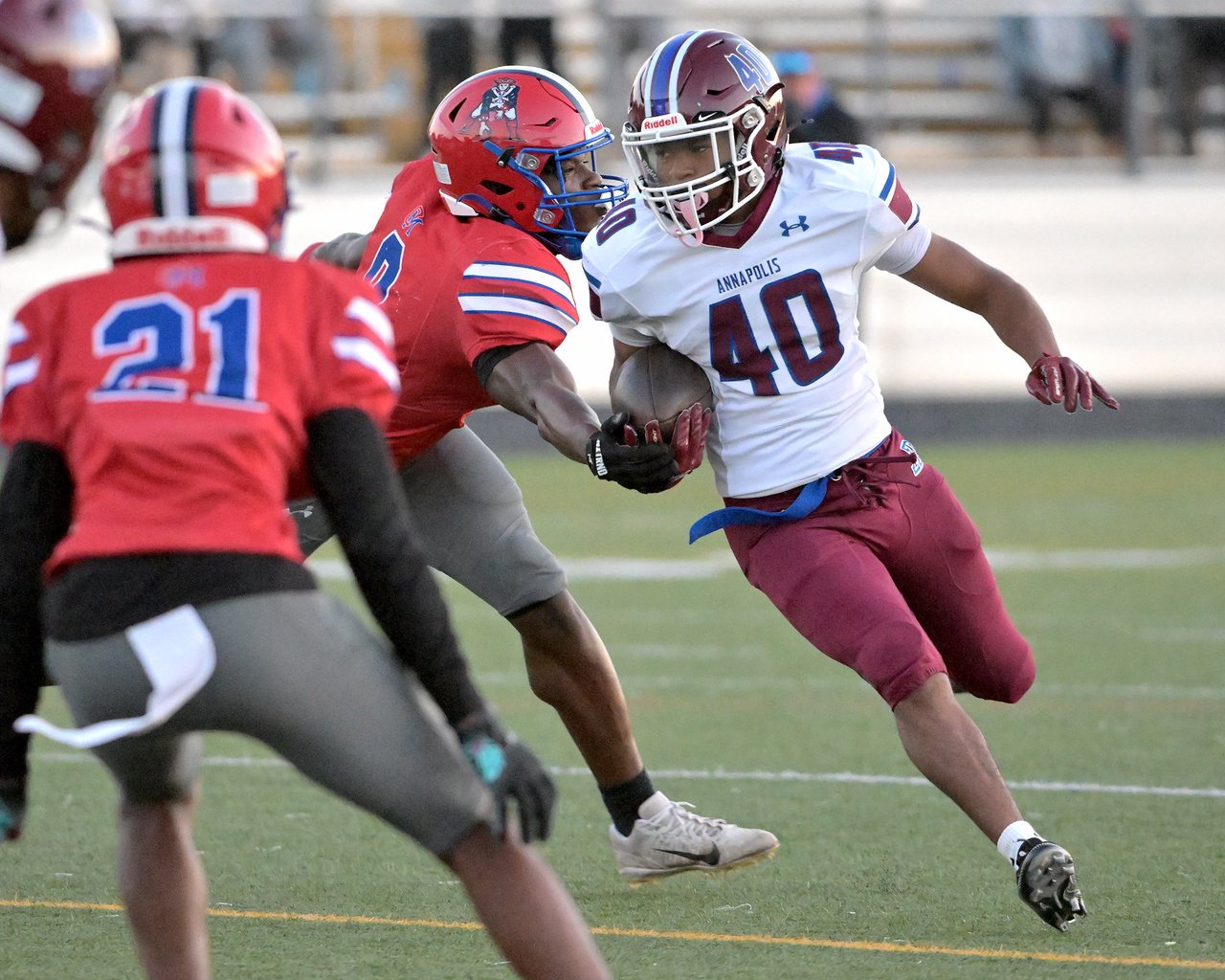 Annapolis Panthers Keith Jones #40 runs with the ball and is stopped by Old Mill Patriots Brandan Carroll #2 in the first quarter. The Annapolis Panthers host the visiting Old Mill Patriots in a high school football held at Severna Park High School Friday evening. (Paul W. Gillespie/Staff)