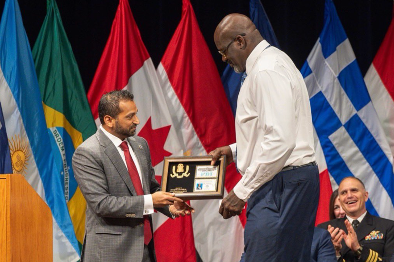 Shaquille O'Neal towered over Kash Patel when receiving his honorary FBI Special Agent award.