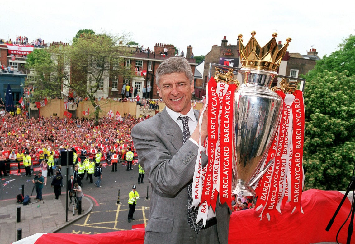 Arsenal manager Arsene Wenger holds the Premier League trophy at Islington Town Hall on May 19, 2004 in London, England.