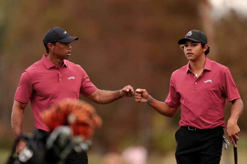 Tiger Woods bumps fists with son, Charlie