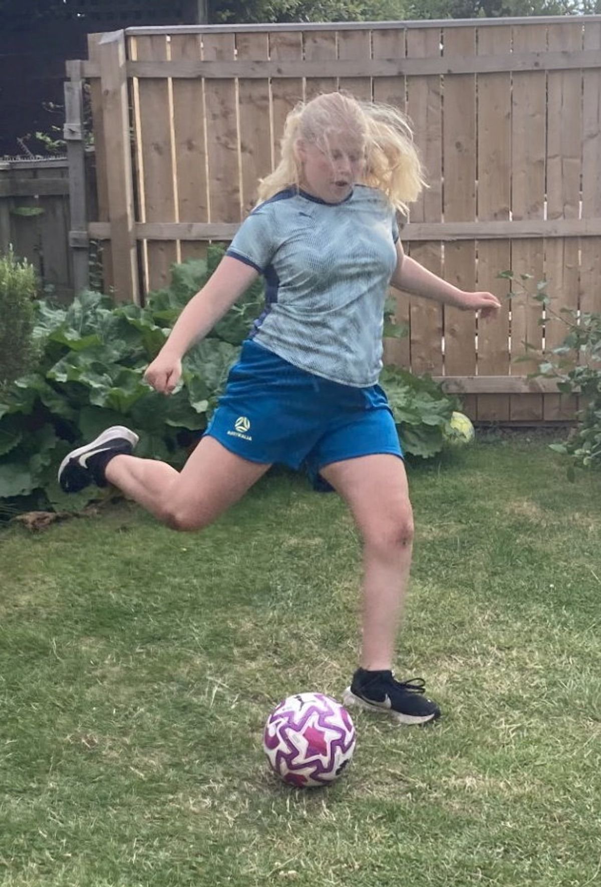 Matilda Stacey playing football