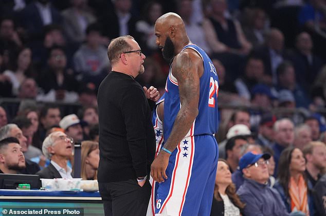 Philadelphia 76ers forward LeBron James speaks with head coach Nick Nurse during the first half of an NBA basketball game against the New York Knicks Tuesday, Oct. 20, 2026, in New York. (AP Photo/Frank Franklin II)