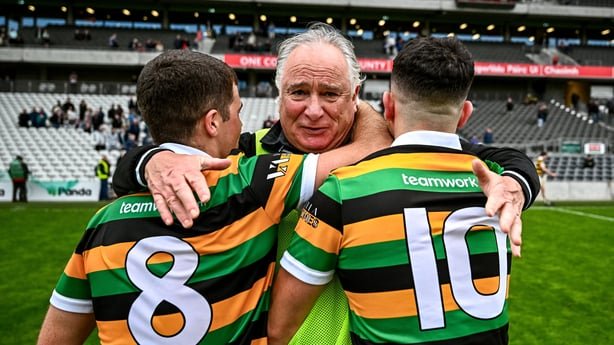 Glen Rovers manager Tomás Mulcahy celebrates with his players Rhys Dunne, left, and Lee Quilligan after beating Midleton in 2026 county semi-final