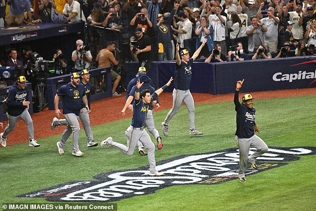 The Brewers players rushed up the steps of the dugout and flooded onto the field