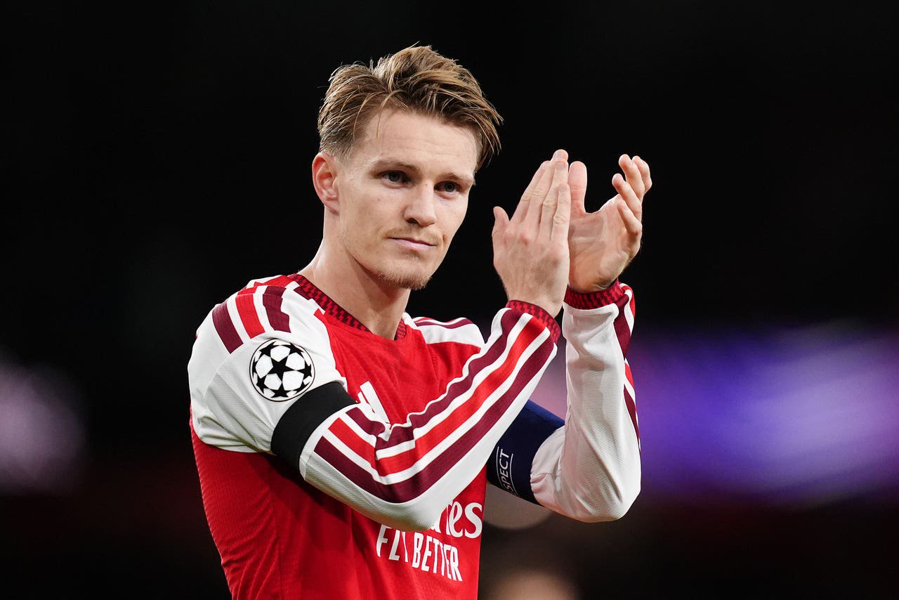 Martin Odegaard applauds the Arsenal fans