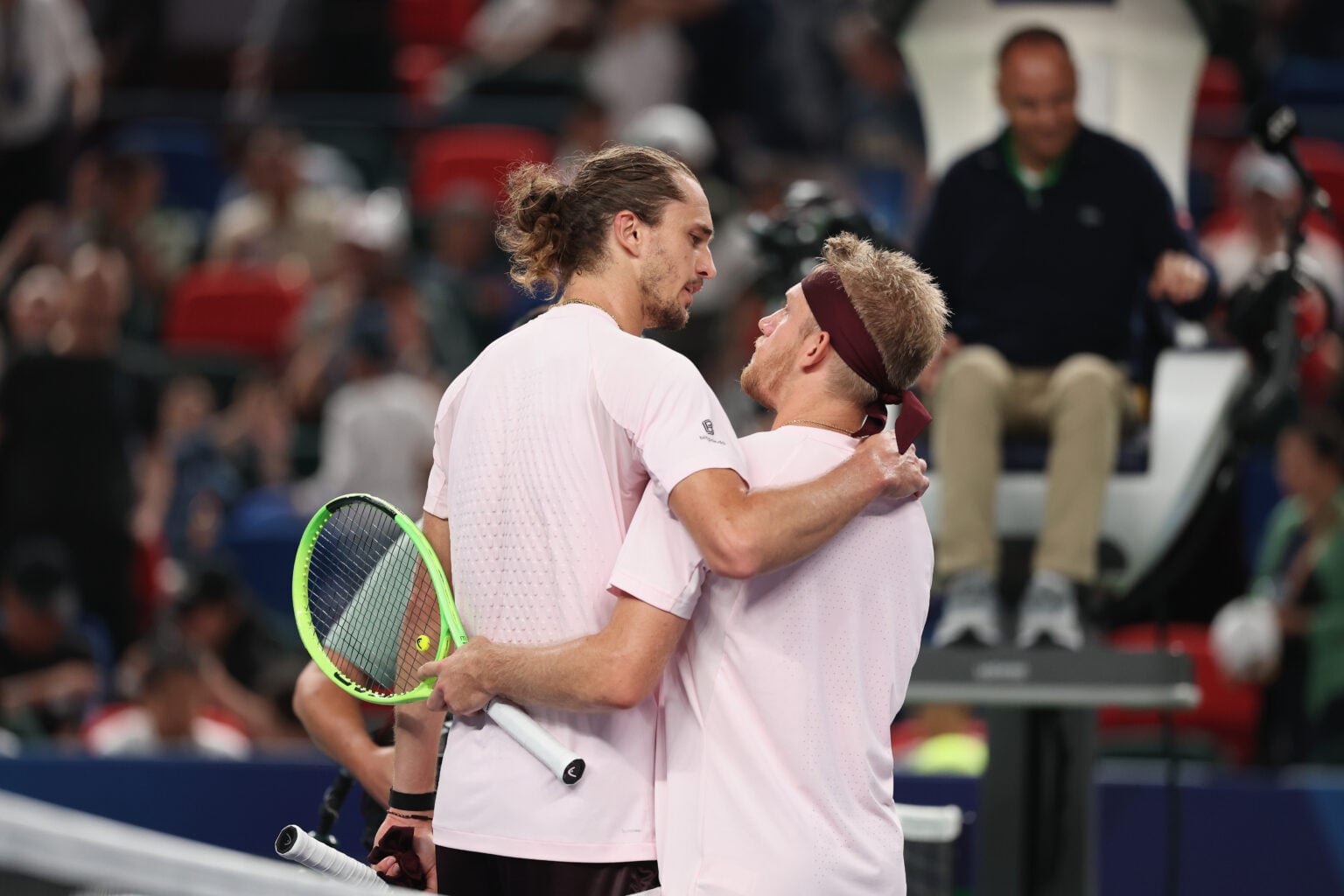 Alejandro Davidovich Fokina and Alexander Zverev embrace.