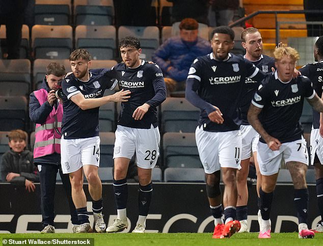 Jones (second from left) is hailed after he capitalised on Neil's error to equalise