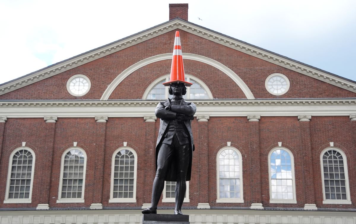 The Samuel Adams statue wears a traffic cone