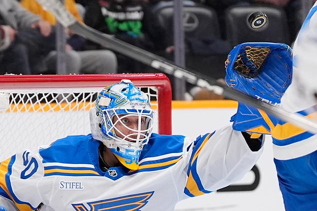 St. Louis Blues goaltender Jordan Binnington (50) defends the goal during the second period of an NHL hockey game against the Nashville Predators, Saturday, Oct. 17, 2026, in Nashville, Tenn. (AP Photo/George Walker IV)