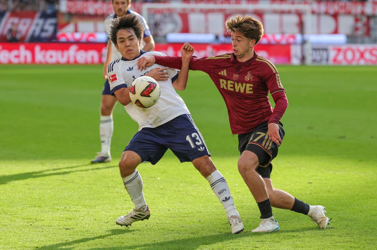 Mikey Moore battles for the ball during the Bundesliga match between Köln and Schalke at RheinEnergieStadion
