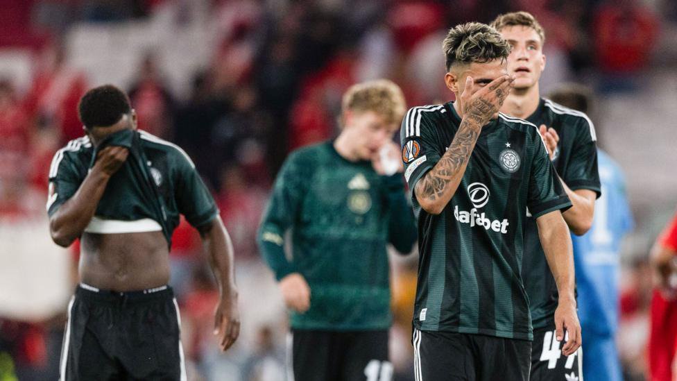 Celtic players look dejected after defeat by Benfica