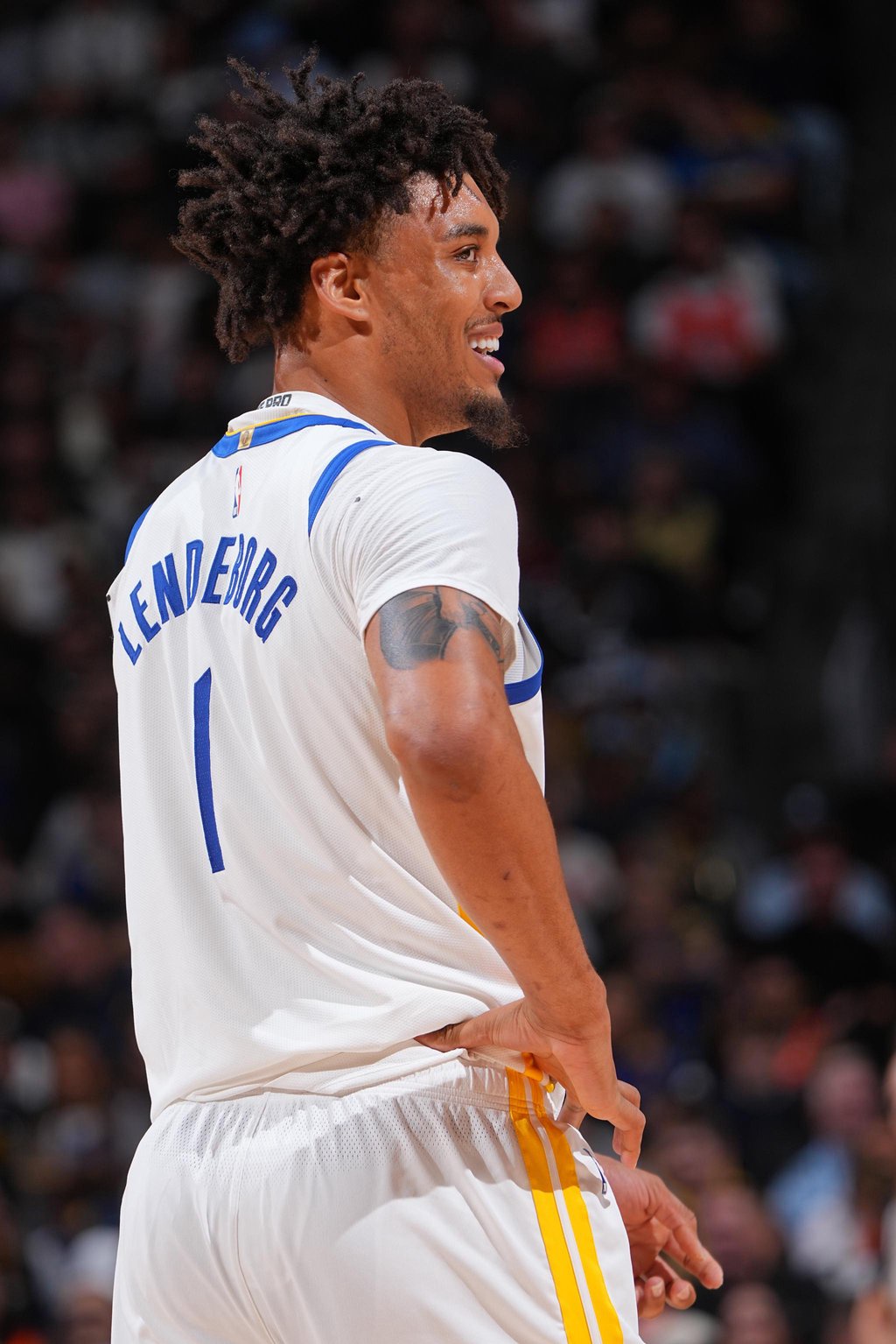 Golden State Warriors' Yaxel Lendeborg smiles during a game.