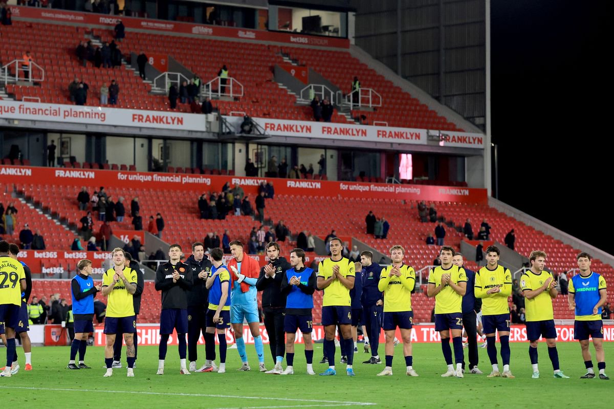Middlesbrough's players and coaching staff applaud the fans