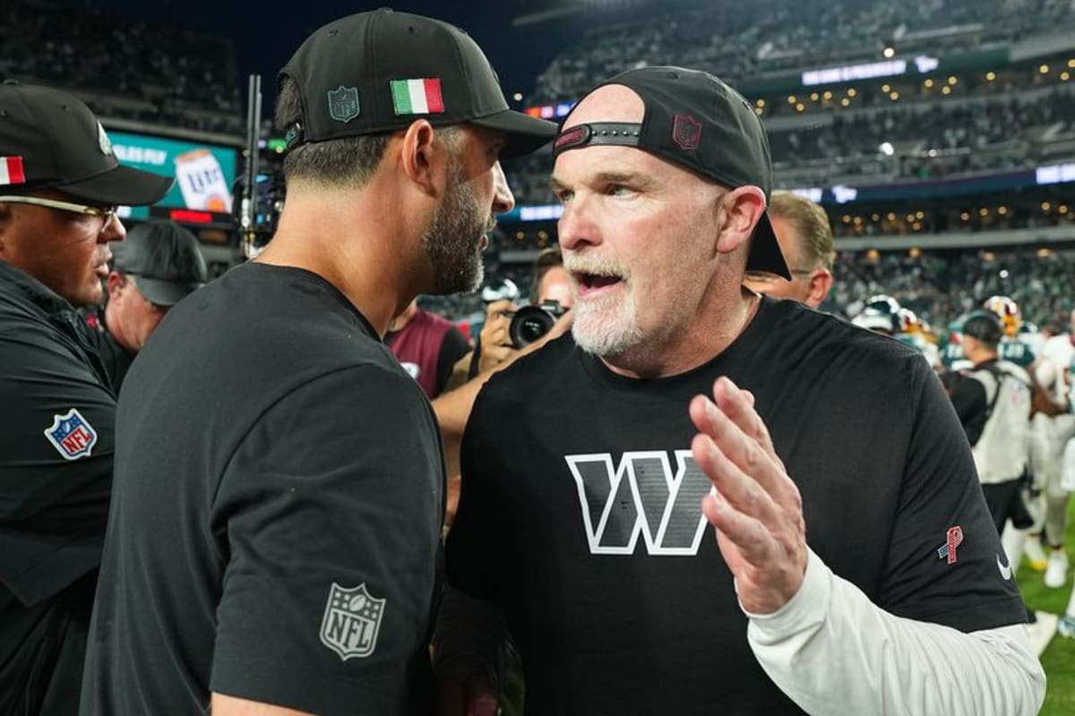 Head coach Nick Sirianni and head coach Dan Quinn of the Washington Commanders shake hands