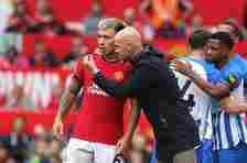 Lisandro Martinez receives some instructions from Erik ten Hag on the Old Trafford touchline.