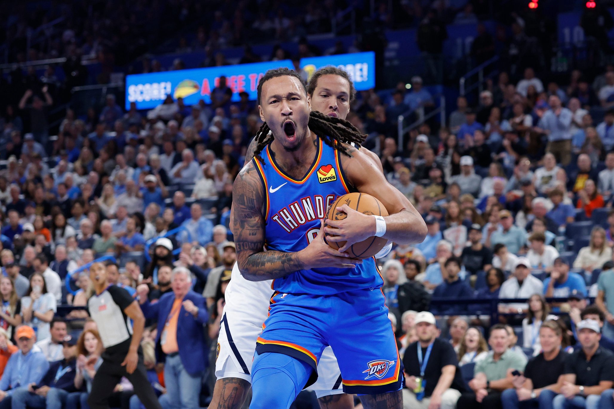 Oct 22, 2026; Oklahoma City, Oklahoma, USA; Oklahoma City Thunder forward Jaylin Williams (6) reacts after grabbing a rebound in front of Denver Nuggets forward Aaron Gordon (32) during the second half at Paycom Center. Mandatory Credit: Alonzo Adams-Imagn Images