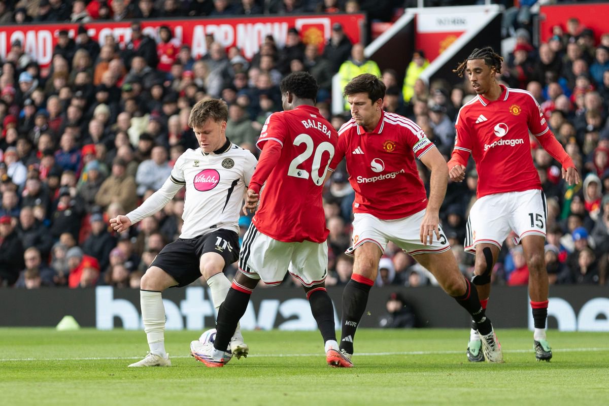 Ben Gannon-Doak #11 of Bournemouth F.C. is tackled by Carlos Baleba #20 of Manchester United F.C. during the Premier League match between Manchester United and Bournemouth at Old Trafford in Manchester, on October 25, 2026