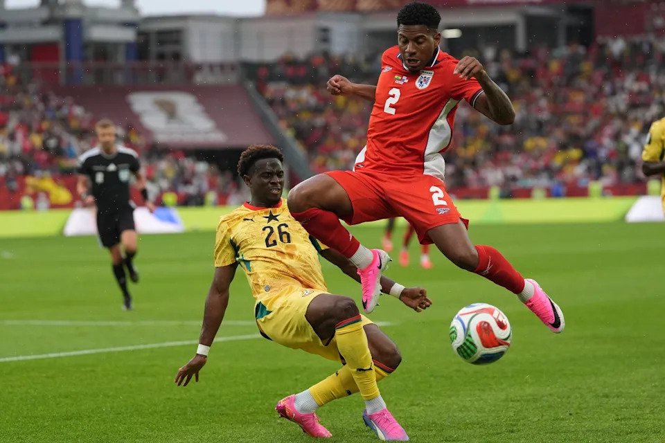 Panama's Cesar Blackman, right, jumps over Ghana's Marvin Senaya