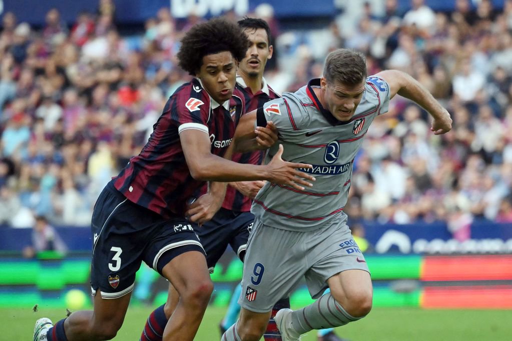 Ifeanyi Ndukwe vies for possession with Alexander Sorloth during Levante vs Atletico Madrid.