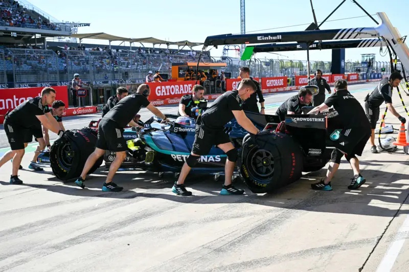 Kimi Antonelli's Mercedes is pushed into the pits in Austin