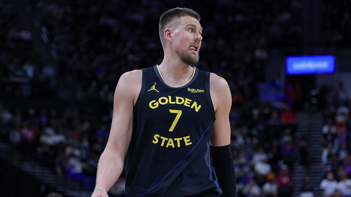Kristaps Porzingis walks on the court during an NBA game between the Golden State Warriors and Los Angeles Clippers.