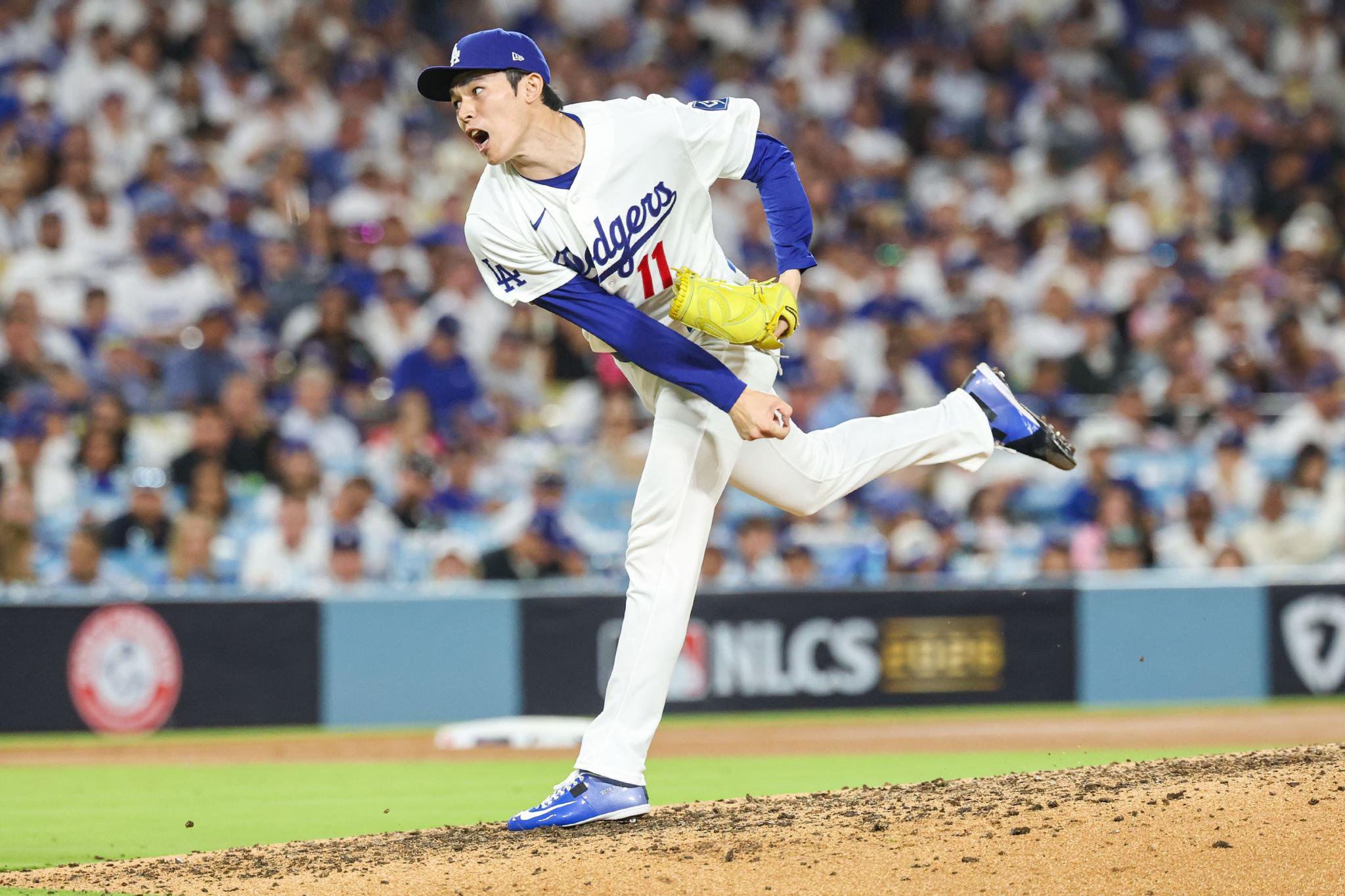Los Angeles Dodgers pitcher Roki Sasaki (11) throws a pitch.