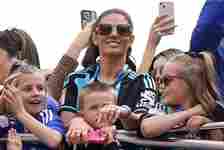 Rebekah Vardy, the wife of Leicester City's Jamie Vardy, on an open-top bus parade in Leicester to celebrate winning the Sky Bet Championship title