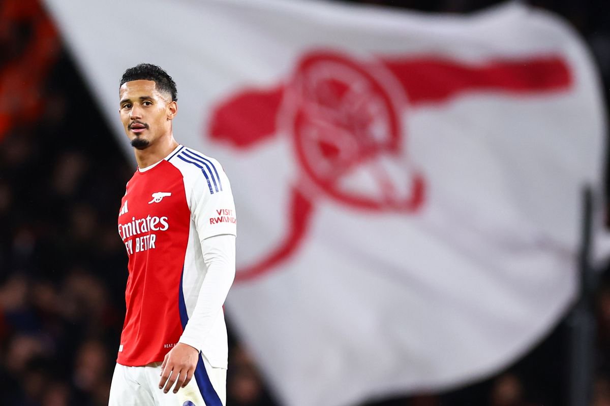 William Saliba of Arsenal with a cannon flag behind him during the Premier League match between Arsenal FC and Manchester United FC at Emirates Stadium