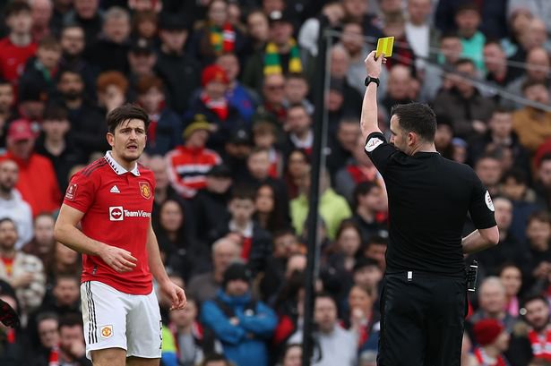 Harry Maguire was booked in the first half against Fulham.