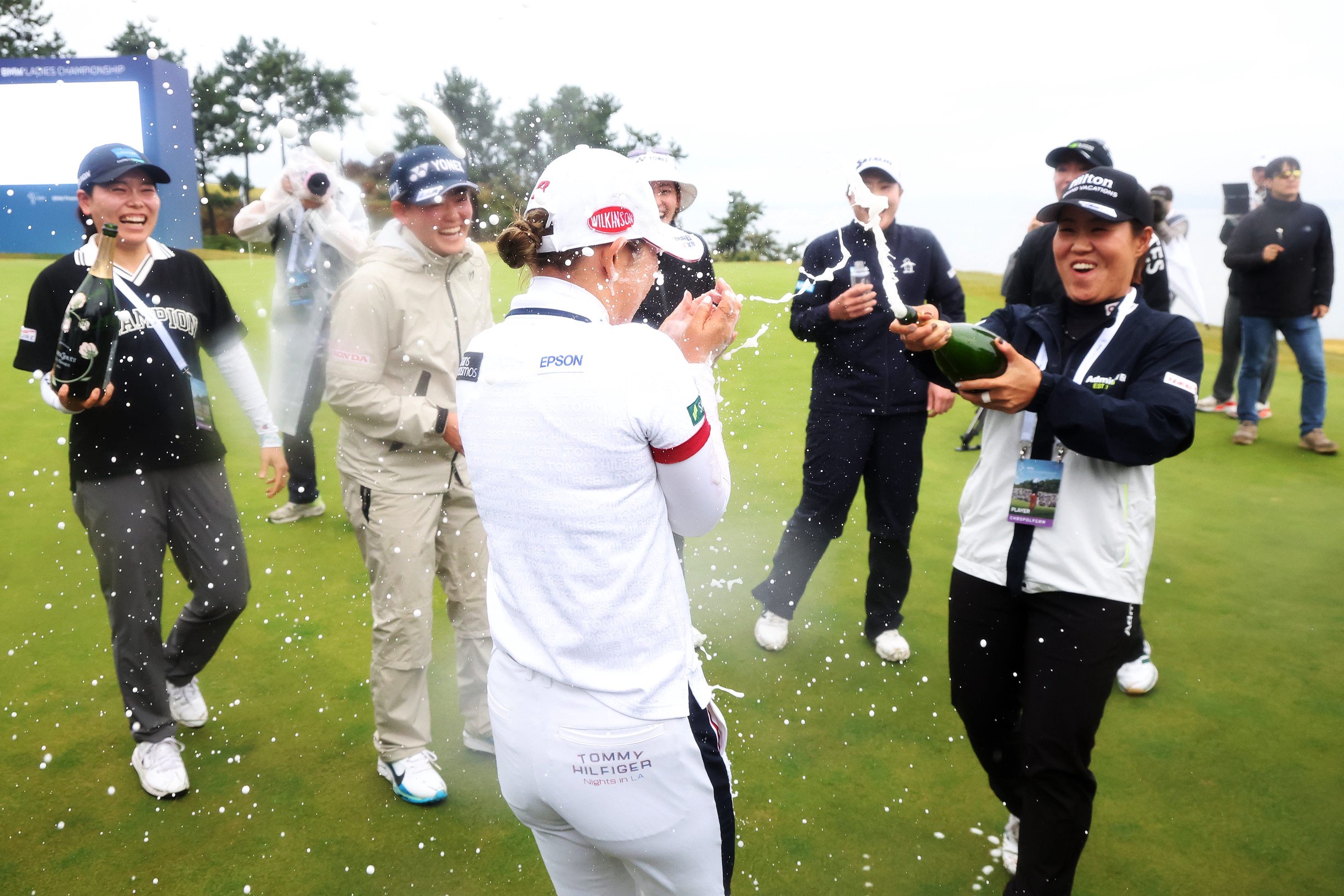 Yuri Yoshida of Japan is showered with champagne on the 18th green after her win following the final round of the BMW Ladies Championship 2026 at Pine Beach Golf Links on October 25, 2026 in Haenam, South Korea. (Photo by Chung Sung-Jun/Getty Images)