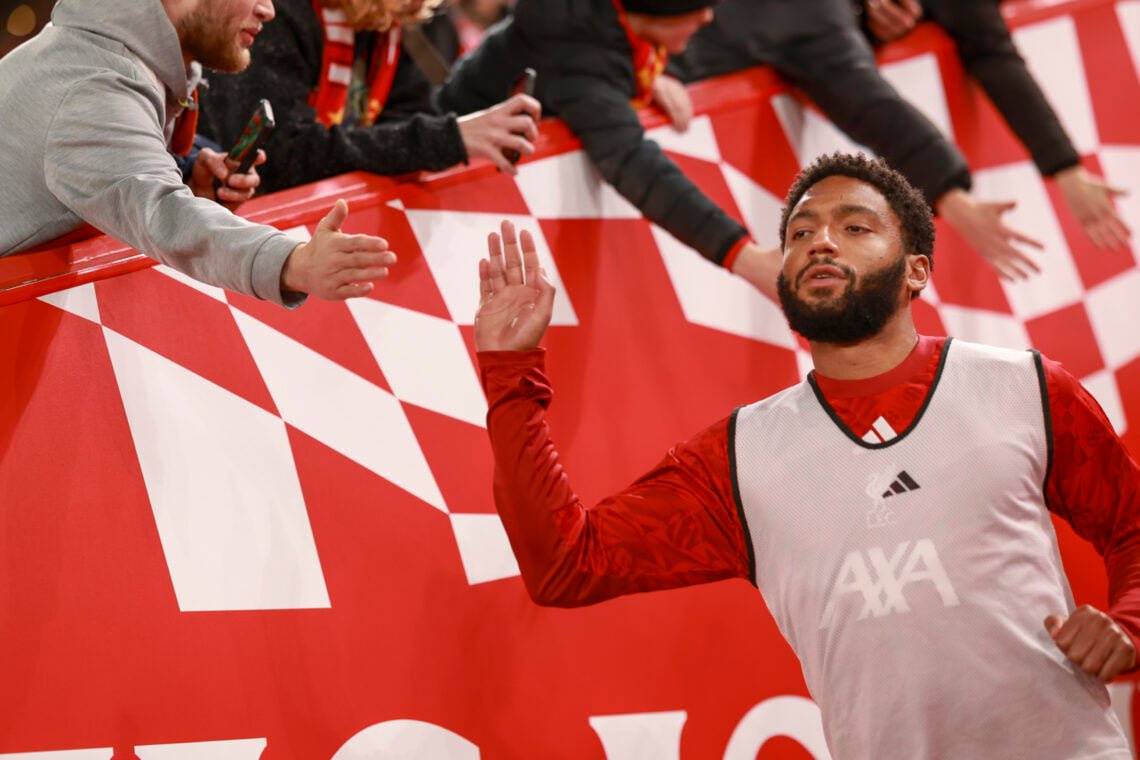 Joe Gomez high fives Liverpool supporters as he runs onto the pitch to warm up ahead of the Reds' Carabao Cup fourth-round clash with Chelsea