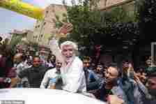 Saeed Jalili leaves after voting in the presidential election at Imam Hasan Mosque on June 28