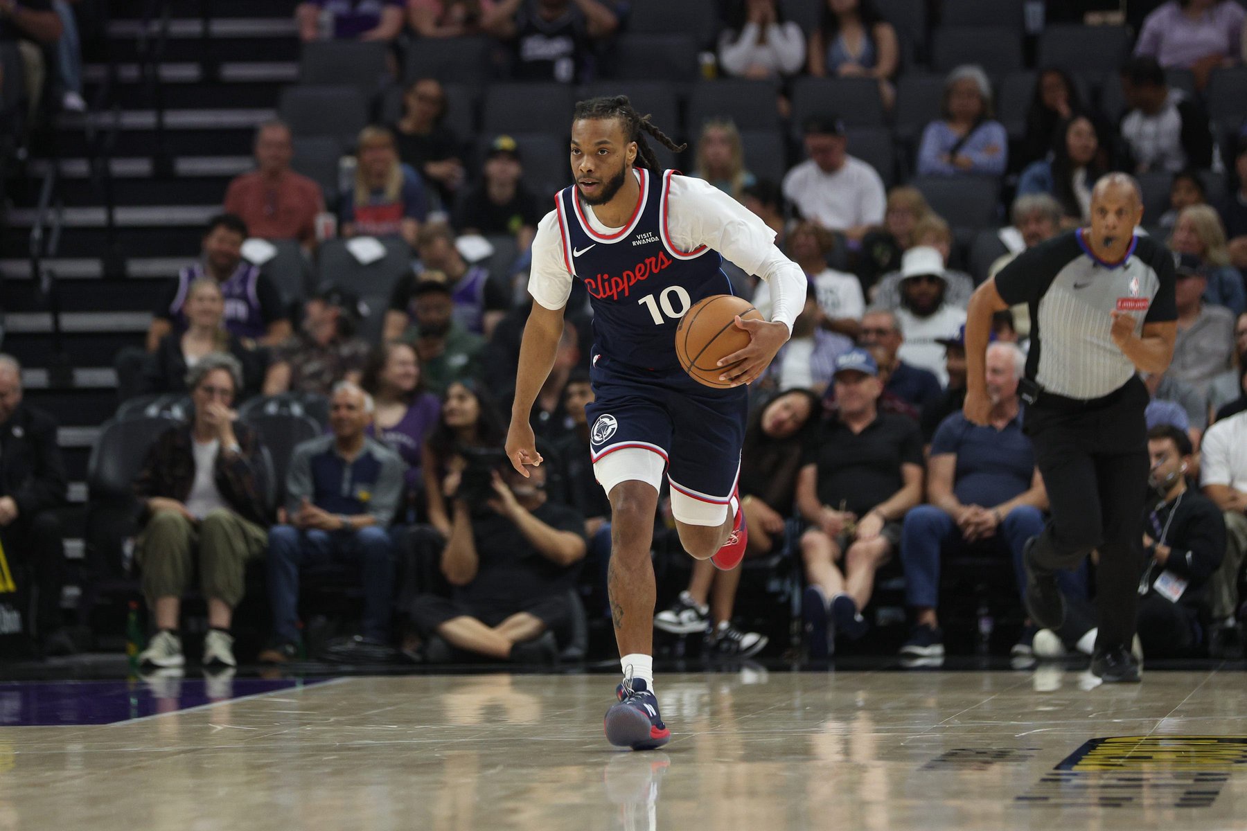 Darius Garland of the Los Angeles Clippers dribbles the ball up the court during the first quarter against the Sacramento Kings at Golden 1 Center on April 5, 2026, in Sacramento, California.