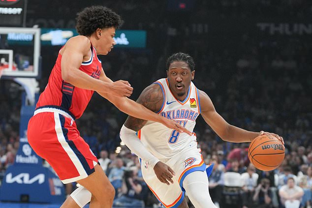 Oklahoma City Thunder guard Jalen Williams, right, drives past Los Angeles Clippers guard Keaton Wagler, left, during the first half of an NBA basketball game, Sunday, Oct. 25, 2026, in Oklahoma City. (AP Photo/Kyle Phillips)