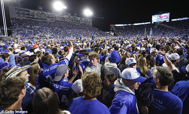 BYU fans storm the field after Saturday's dramatic victory over visiting Notre Dame