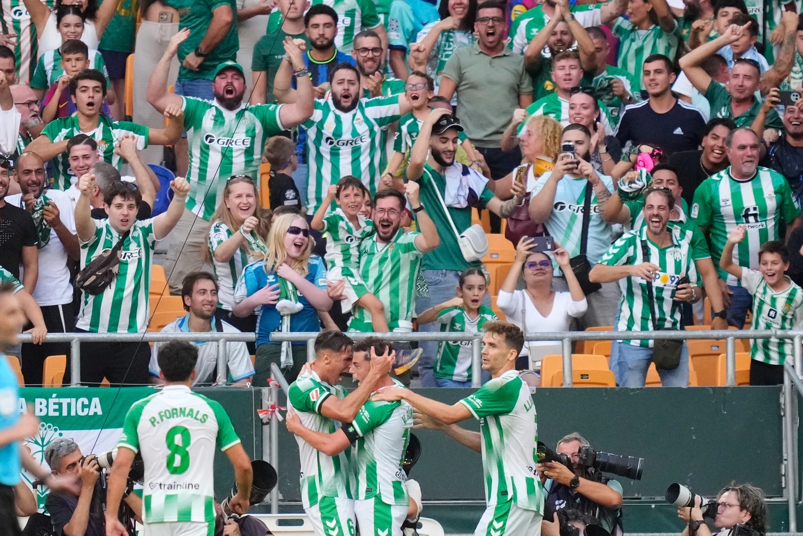 Betis' Valentin Gomez, centre, celebrates after scoring his side's opening goal during the Spanish La Liga match between Real Betis and Barcelona in Seville, Oct. 17, 2026. (AP)