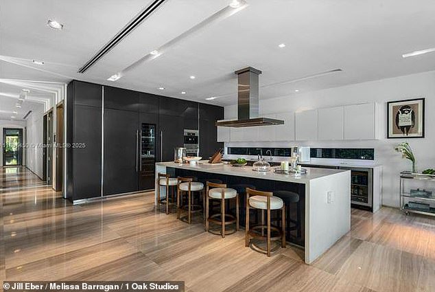 Inside, the tri-level property features expansive living and dining areas, rich hardwood and marble floors, custom cabinetry and a chef’s kitchen equipped with high-end Wolf and Miele appliances