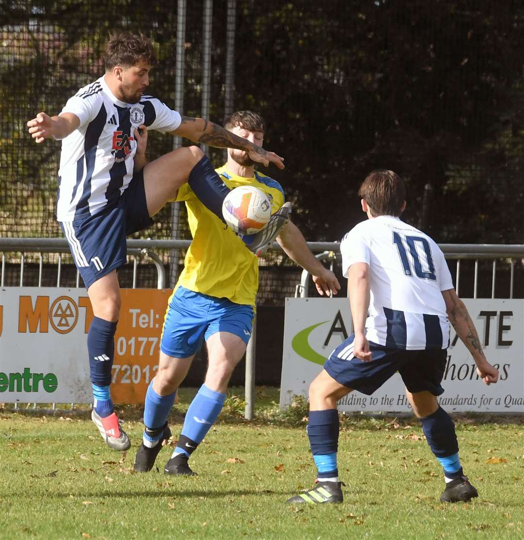 Action from Moulton Harrox's home defeat to Sawtry. Photo: Chris Lowndes